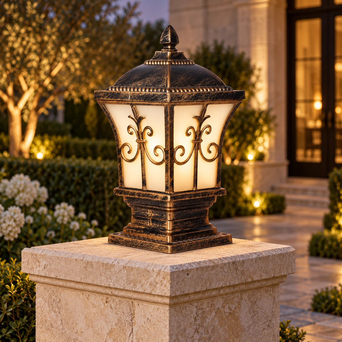 Ornate frosted panel pillar light on a limestone entrance pillar