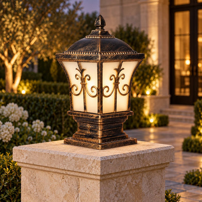 Ornate frosted panel pillar light on a limestone entrance pillar