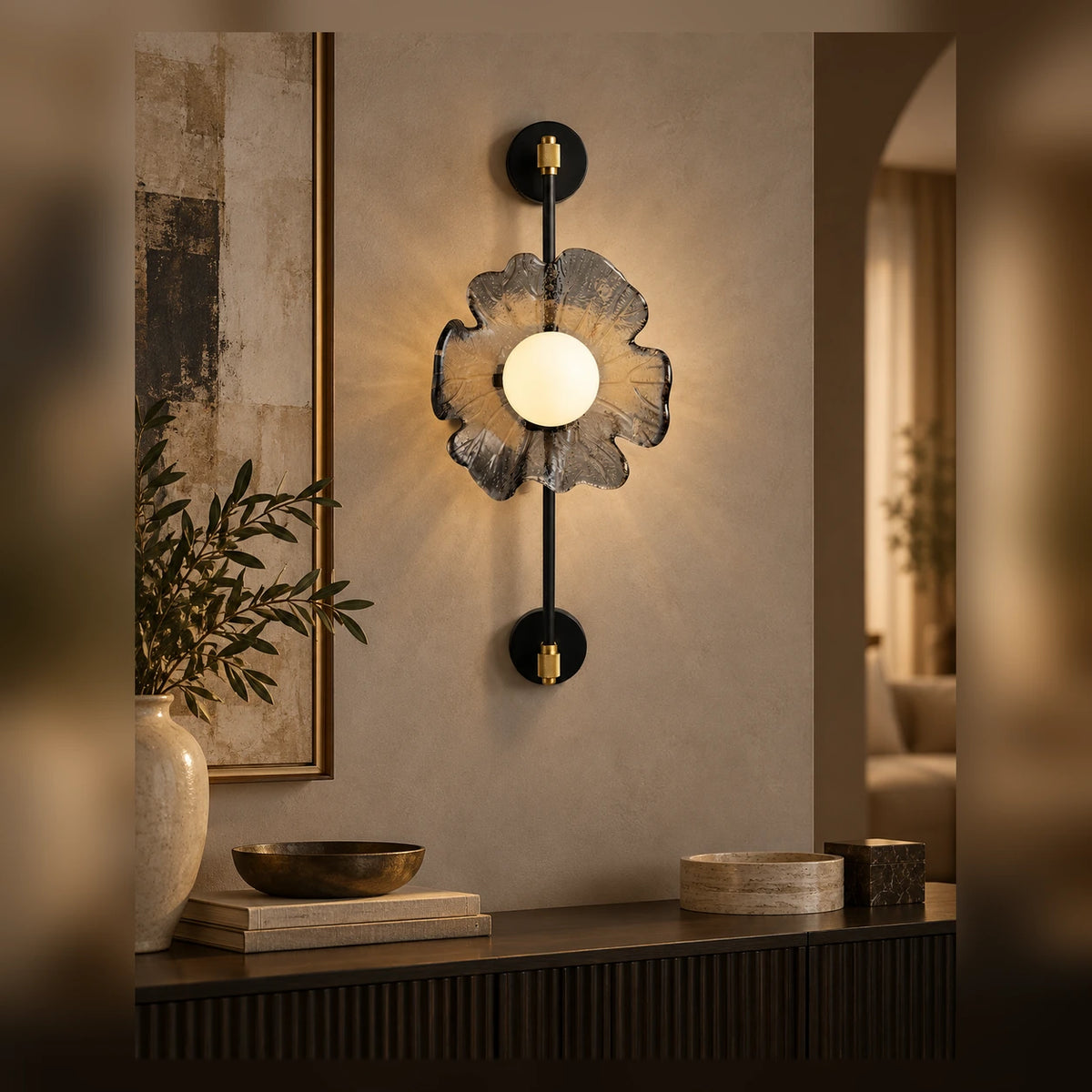 Sculptural flower globe wall light above a living-room console