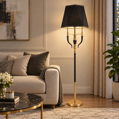 Three-arm shaded floor lamp beside a contemporary sofa
