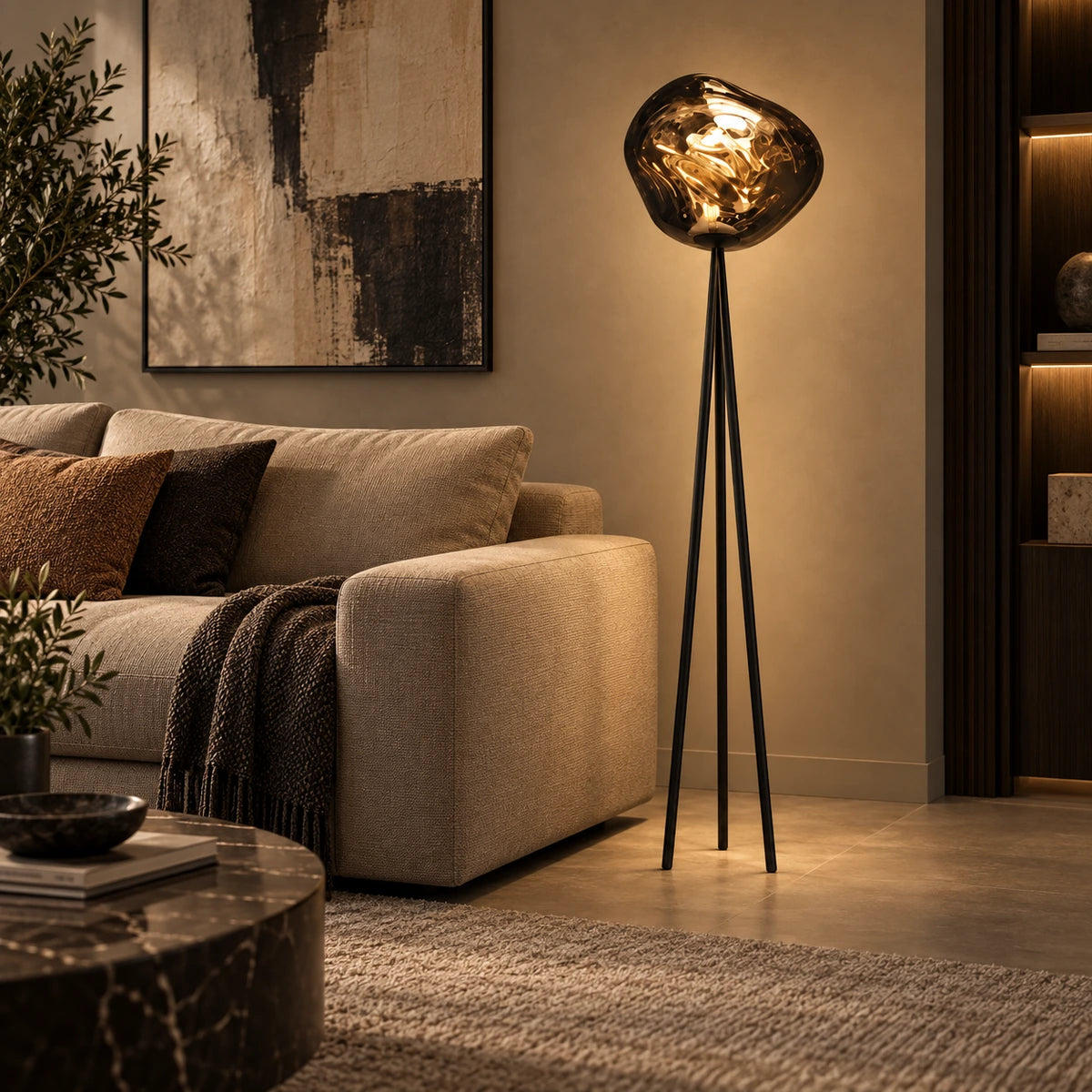 Smoke globe tripod floor lamp beside a contemporary sofa