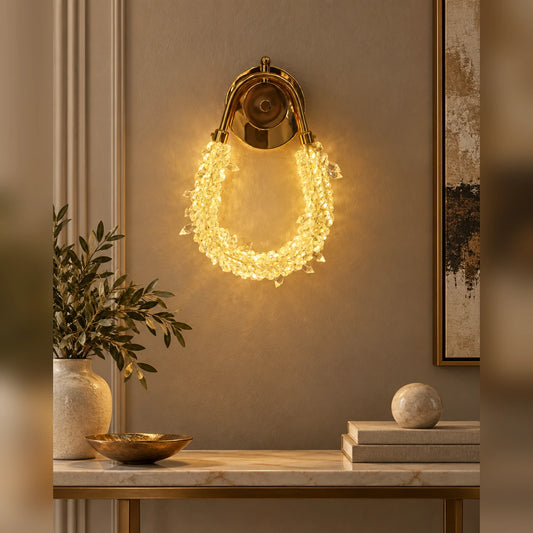 Faceted loop decorative wall light above a living-room console