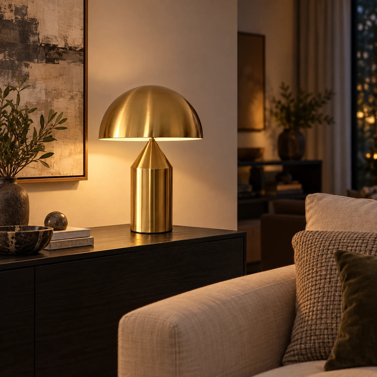 Antique-gold dome table lamp on a living-room console
