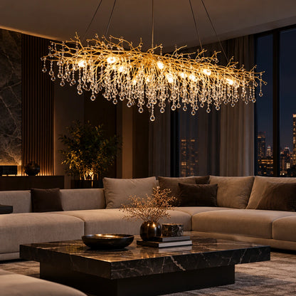 Gold clear crystal branch linear chandelier in a living room