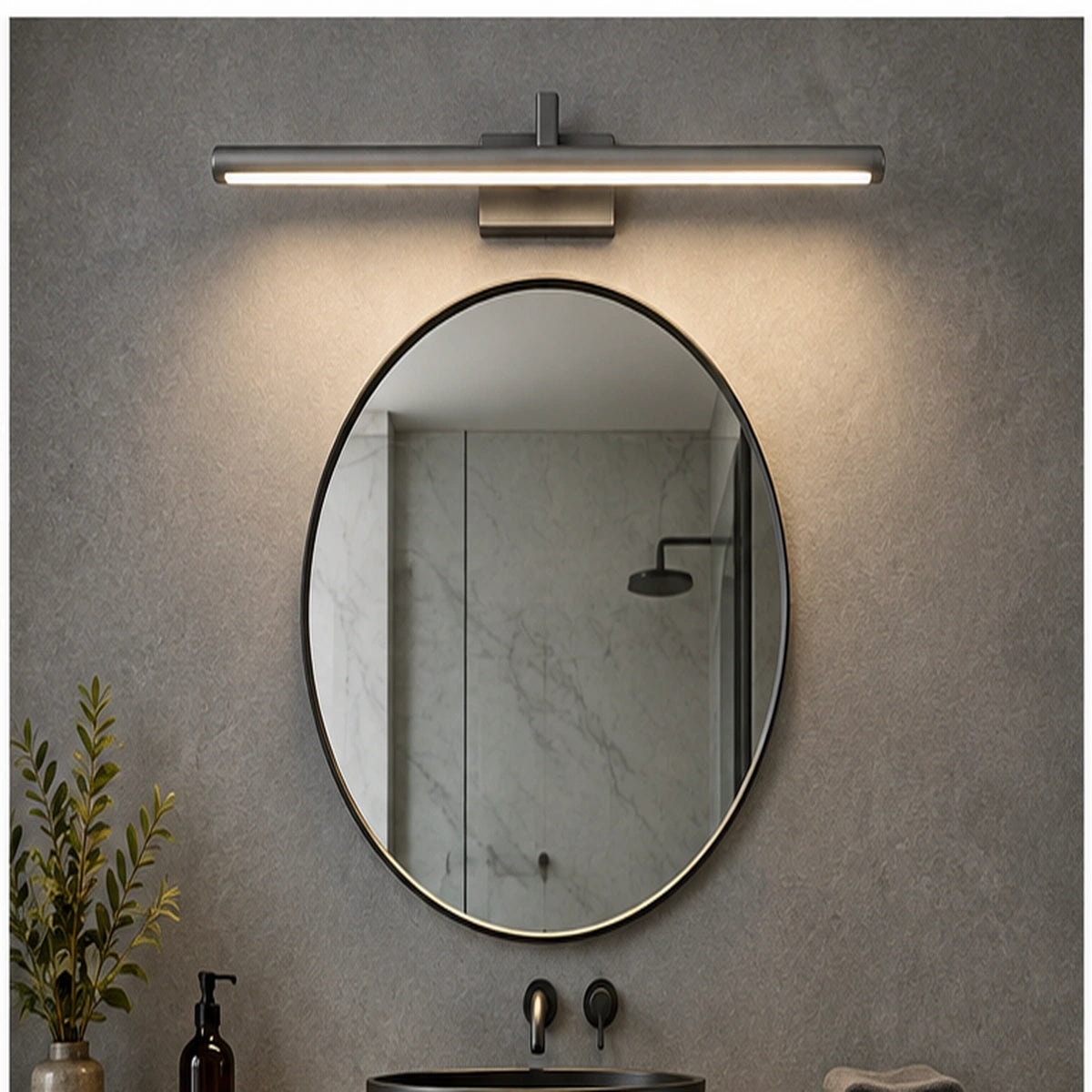 Gray slim linear mirror light above a round bathroom mirror