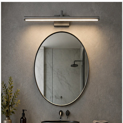 Gray slim linear mirror light above a round bathroom mirror