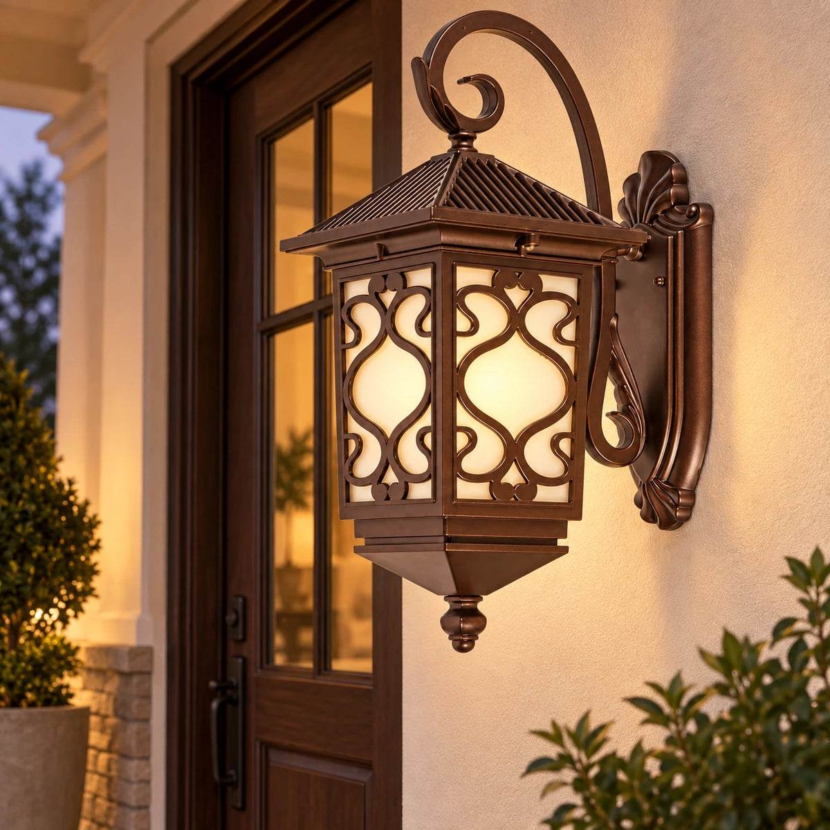 Ornate scrollwork wall lantern beside a covered entry door