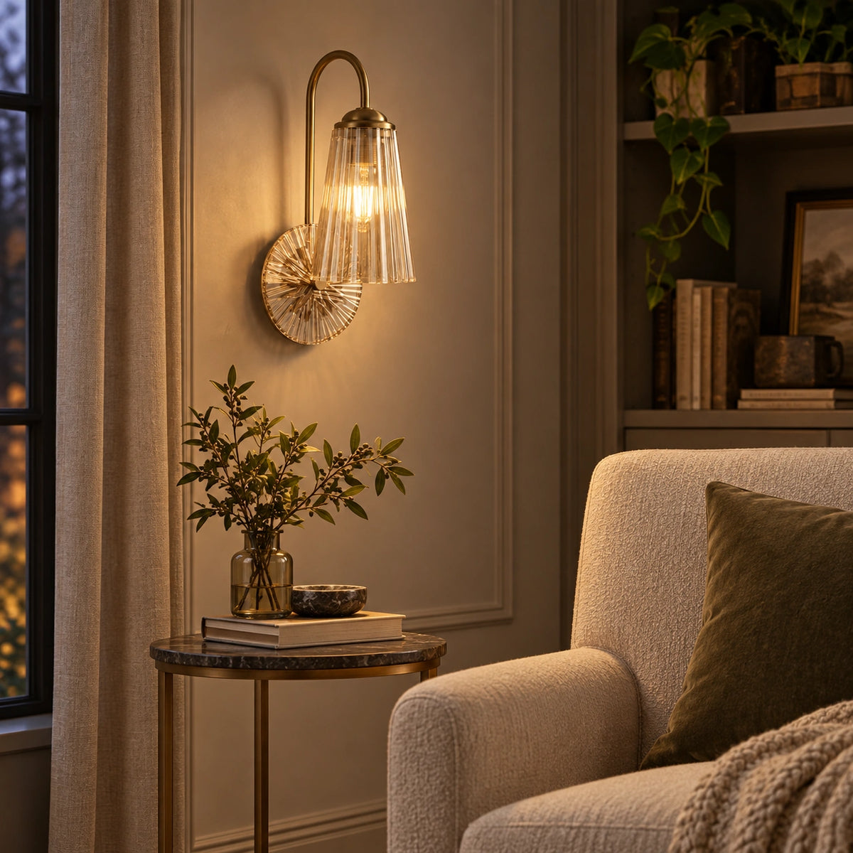 Fluted bell glass wall sconce in a reading corner