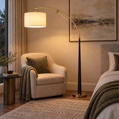 Arc floor lamp with drum shade in a reading corner