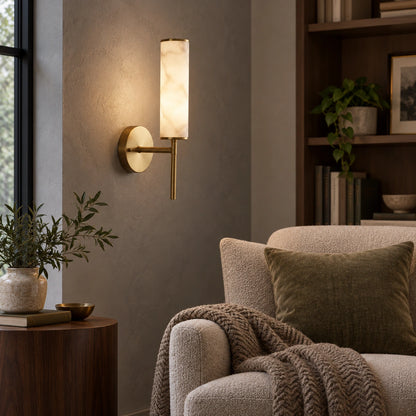 Alabaster-look cylinder wall sconce in a reading corner