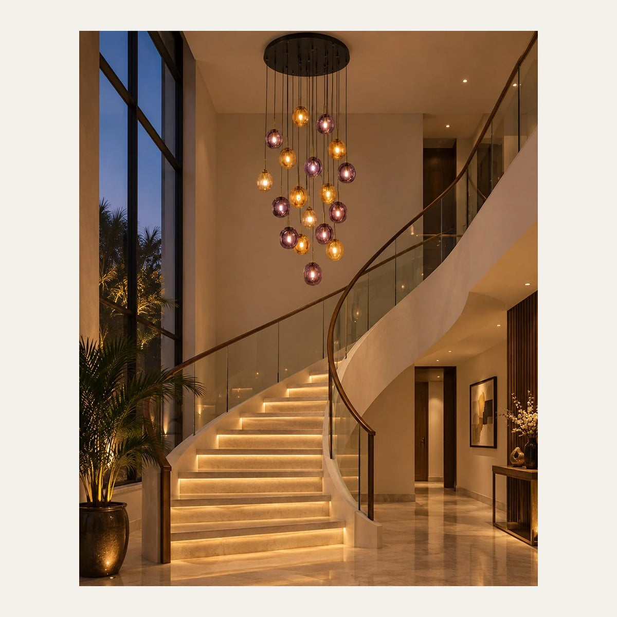 Amber and smoke glass globe cascade chandelier above a curved staircase