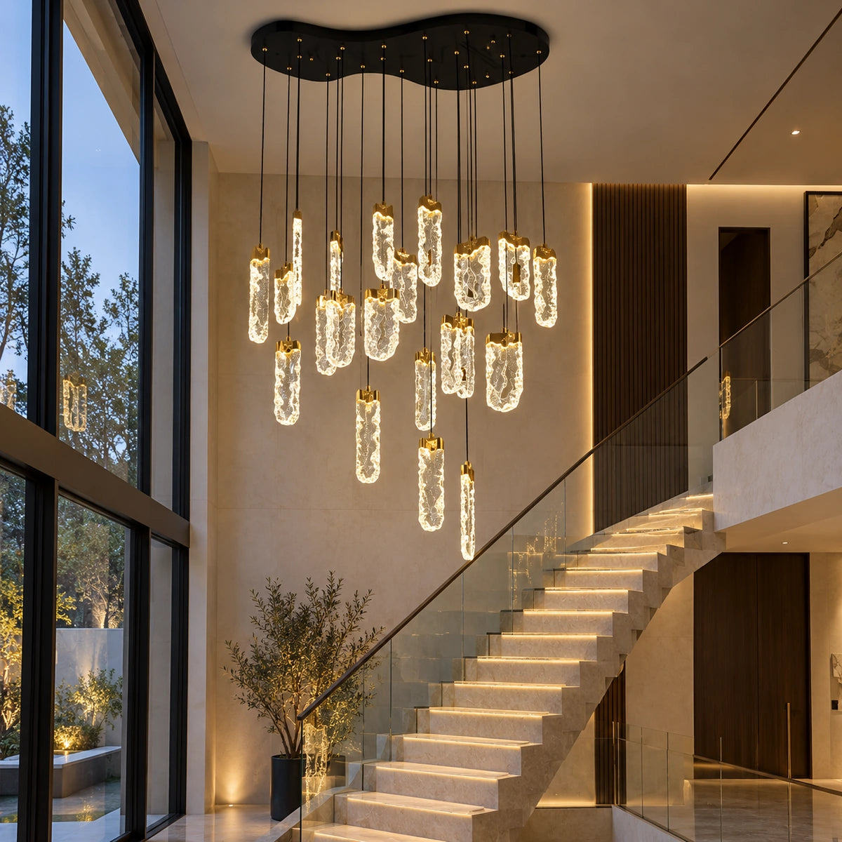 Twenty-two-light clear loop chandelier beside a staircase