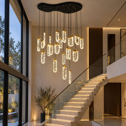 Twenty-two-light clear loop chandelier beside a staircase
