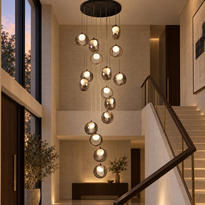 Cascading smoke glass chandelier in a stairwell void