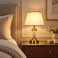Crystal accent table lamp on a bedroom side table