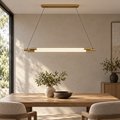 Twin linear tube pendant above a contemporary dining table