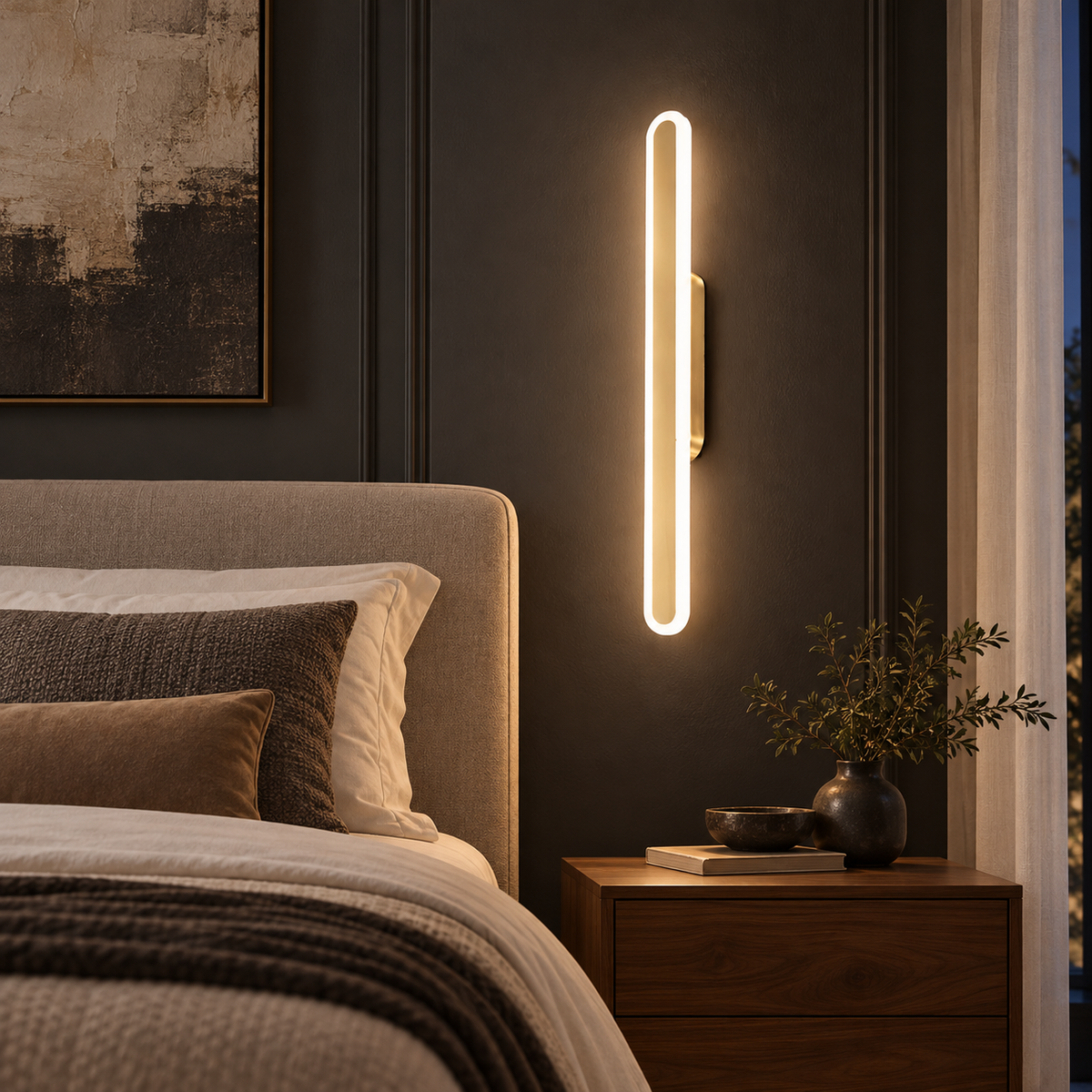 Luma Loop gold and white wall light beside an upholstered bed in a warm hotel-style bedroom
