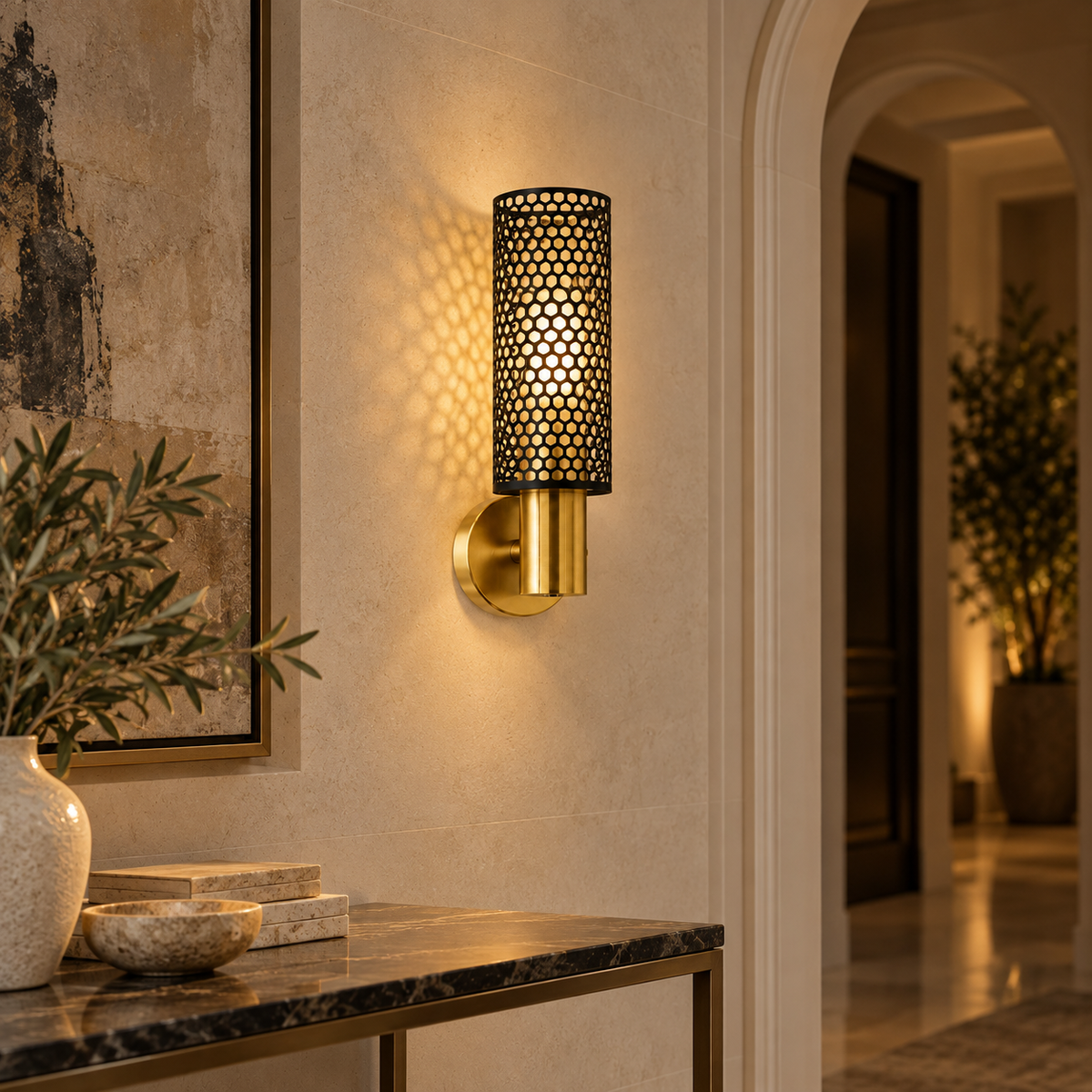 Vesper black honeycomb and brushed-gold LED wall light in a refined evening hallway
