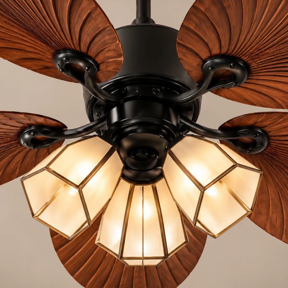 Close-up of Arbor fan's three faceted glass shades and curved blade brackets
