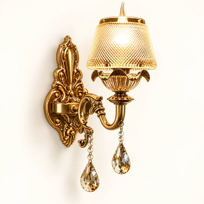 Antique gold crystal wall light on a warm-white background