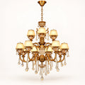 Two-tier antique gold crystal chandelier on a warm-white background