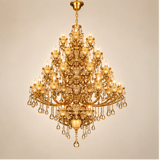 Monumental antique gold five-tier crystal chandelier on warm white