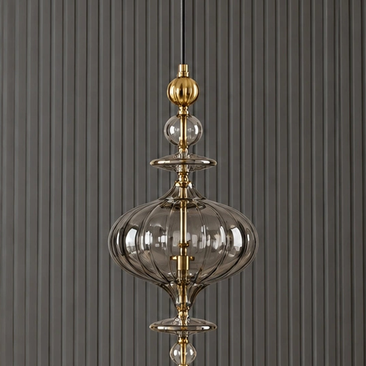 Full pendant detail showing the elongated ornamental composition