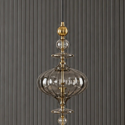 Full pendant detail showing the elongated ornamental composition