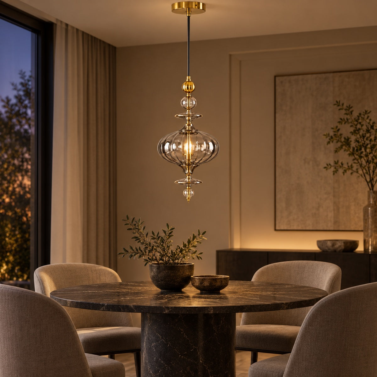Ornate smoke-glass and gold pendant above a round dining table