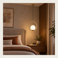 Orbital globe pendant in a premium bedroom setting