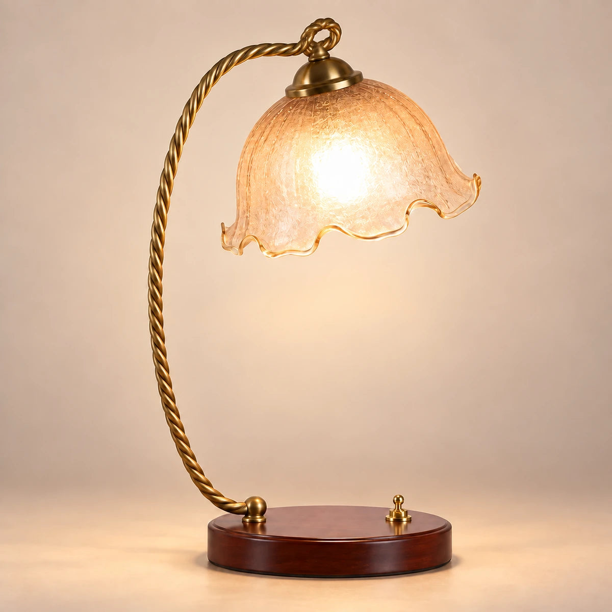 Amber tulip table lamp with twisted antique-gold arm