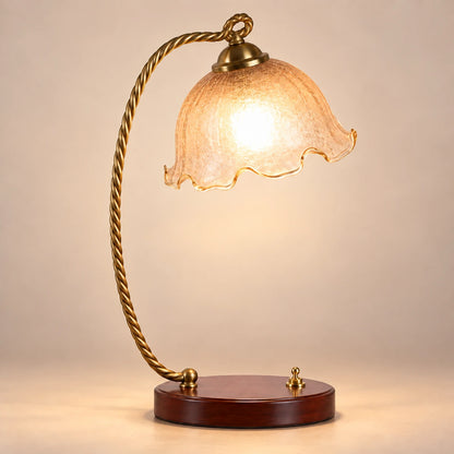 Amber tulip table lamp with twisted antique-gold arm