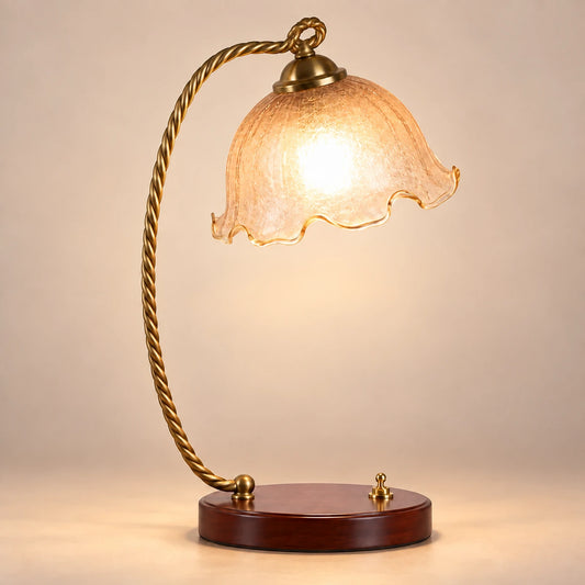 Amber tulip table lamp with twisted antique-gold arm