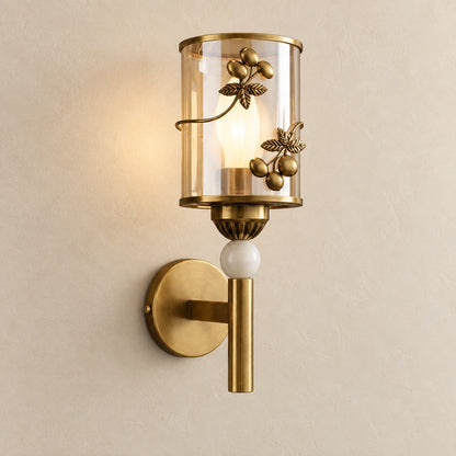 Botanical cylinder wall sconce on a warm studio wall