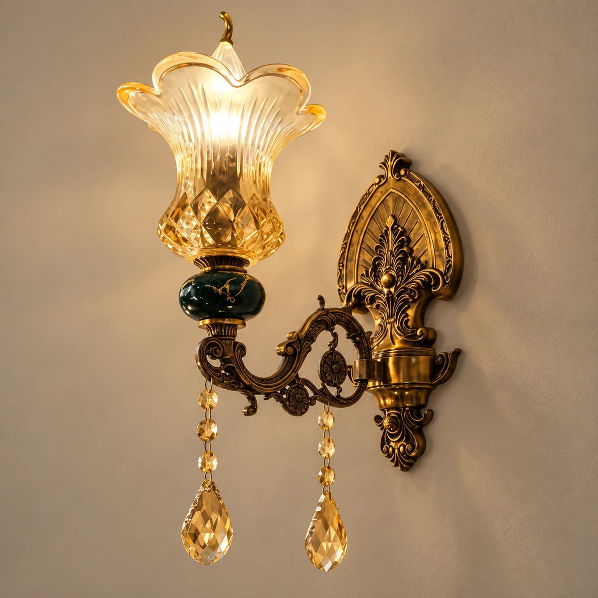 Green and amber floral glass wall sconce on a warm studio wall