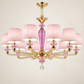 Pink shade ten-light chandelier on a warm studio background