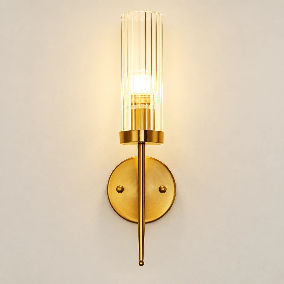 Tall ribbed glass cylinder wall sconce with brass-tone mount