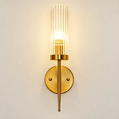 Tall ribbed glass cylinder wall sconce with brass-tone mount