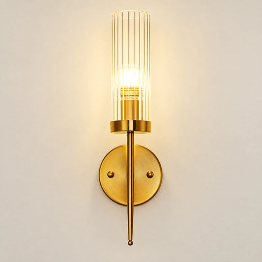 Tall ribbed glass cylinder wall sconce with brass-tone mount