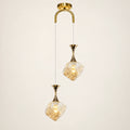 Textured-glass two-light pendant on a warm studio background