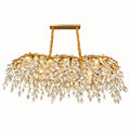 Illustration of linear gold-tone crystal drop chandelier; room scale and installation height are illustrative