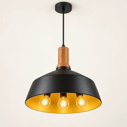 Black dome three-light pendant on a warm studio background