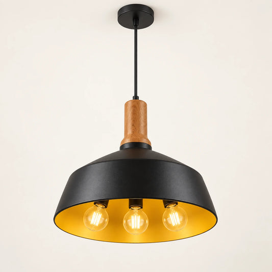 Black dome three-light pendant on a warm studio background