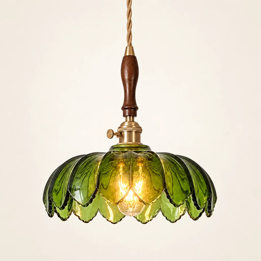 Green petal glass pendant on a warm studio background