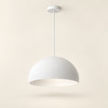 White soft dome pendant light on a warm studio background