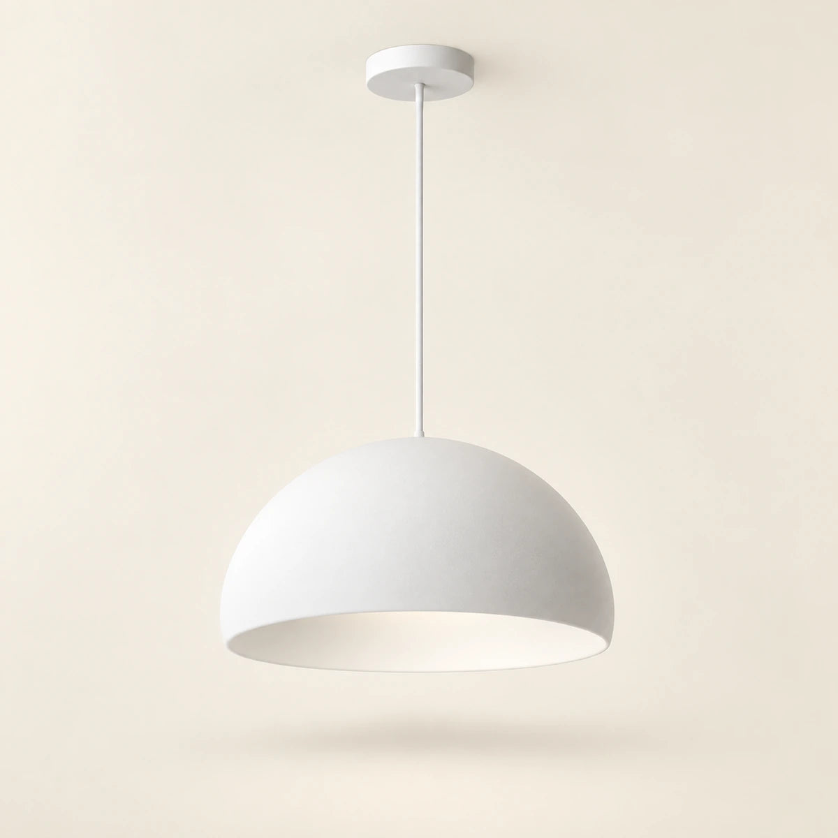 White soft dome pendant light on a warm studio background
