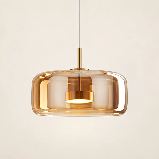 Amber glass capsule pendant in warm brass tone