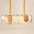 Frosted-disc linear pendant on a warm studio background