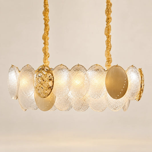 Frosted-disc linear pendant on a warm studio background