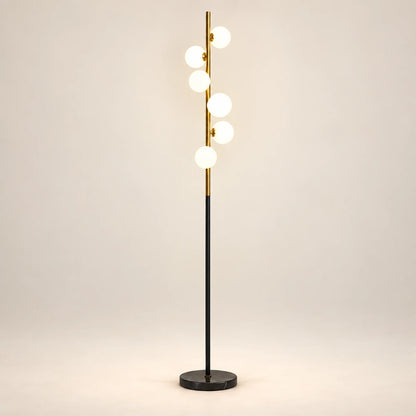 Milky globe column floor lamp on a warm studio background